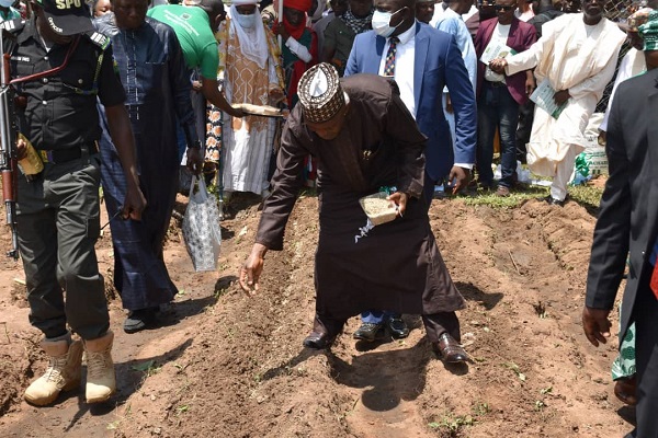 FMARD Minister, Abubakar Mohammed, planting pasture seeds
